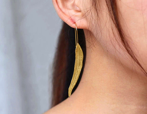 Girl wearing Gold Autumn Leaf Earring - Lotus Fun